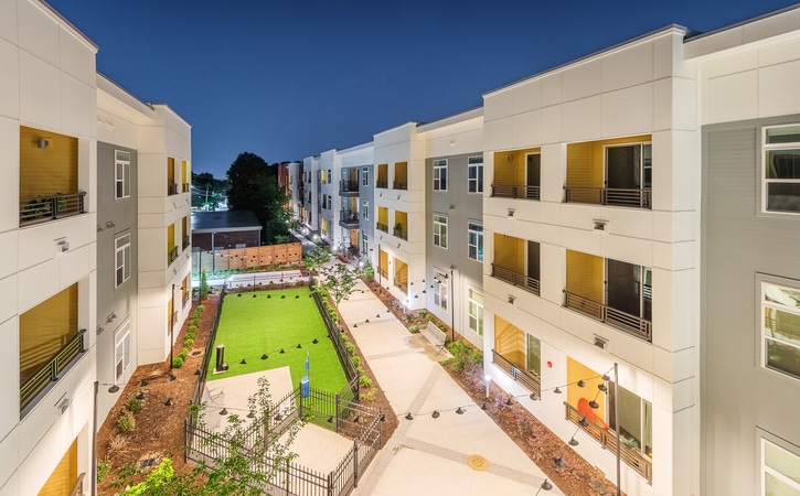 The Edition on Oberlin Raleigh NC Apartments and Townhomes Building Exterior Pet Park View Night